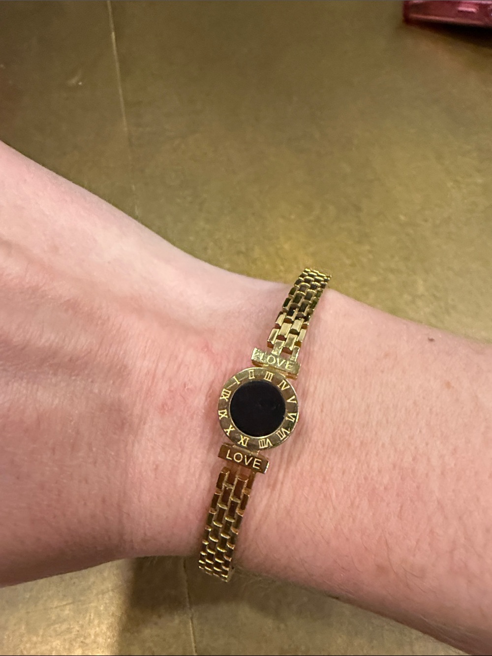 Gold-tone LOVE Bracelet with Black Dial